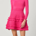 Vibrant pink dress with a sleek, structured silhouette, styled for a festive occasion