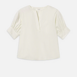 Light-colored blouse on a white background