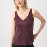Woman wearing a maroon tank top against a white background