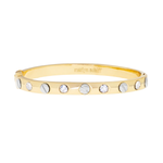 Gold bracelet with embedded stones on a white background
