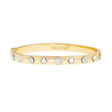 Gold bracelet with embedded stones on a white background