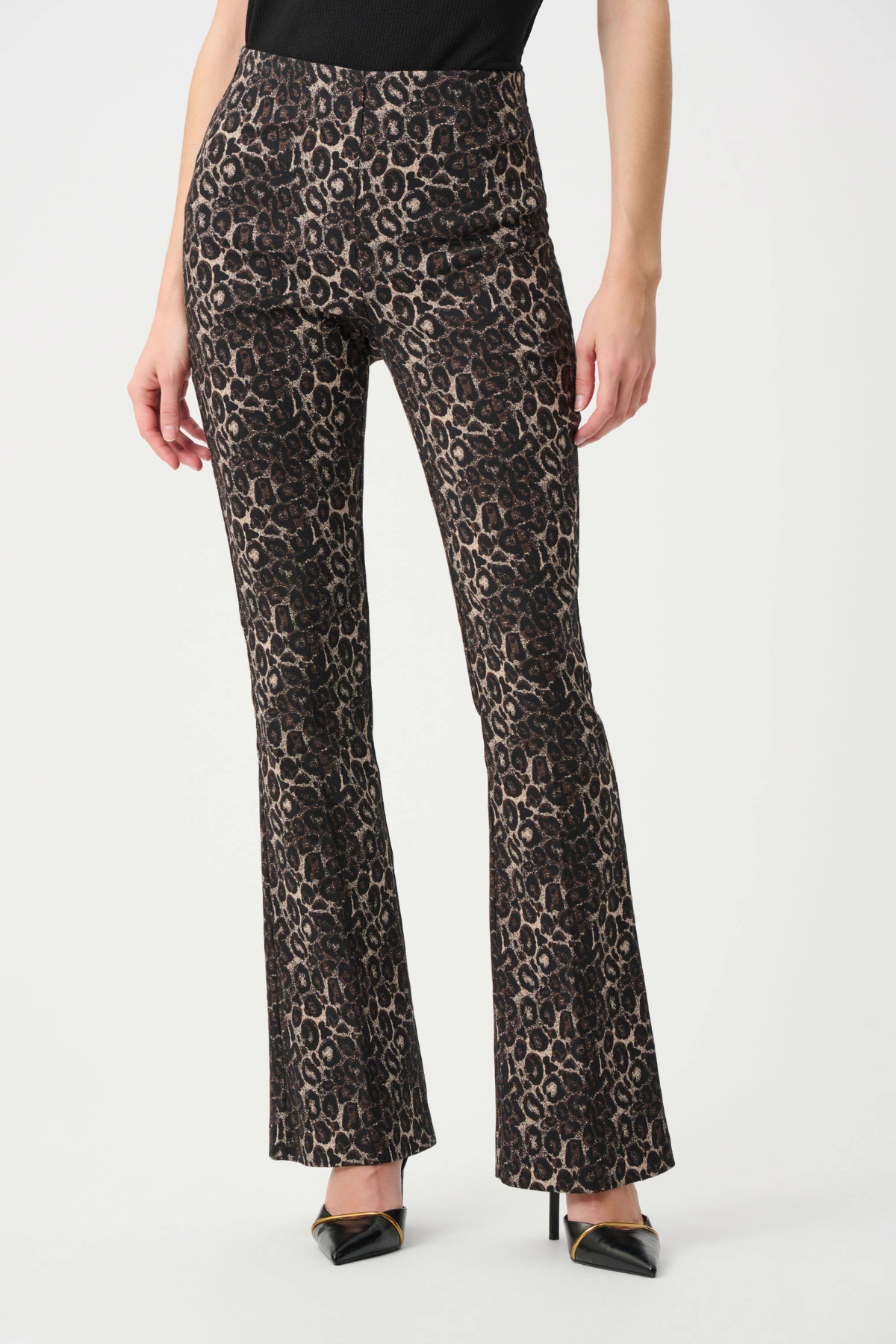 Leopard print pants worn by a person on a white background
