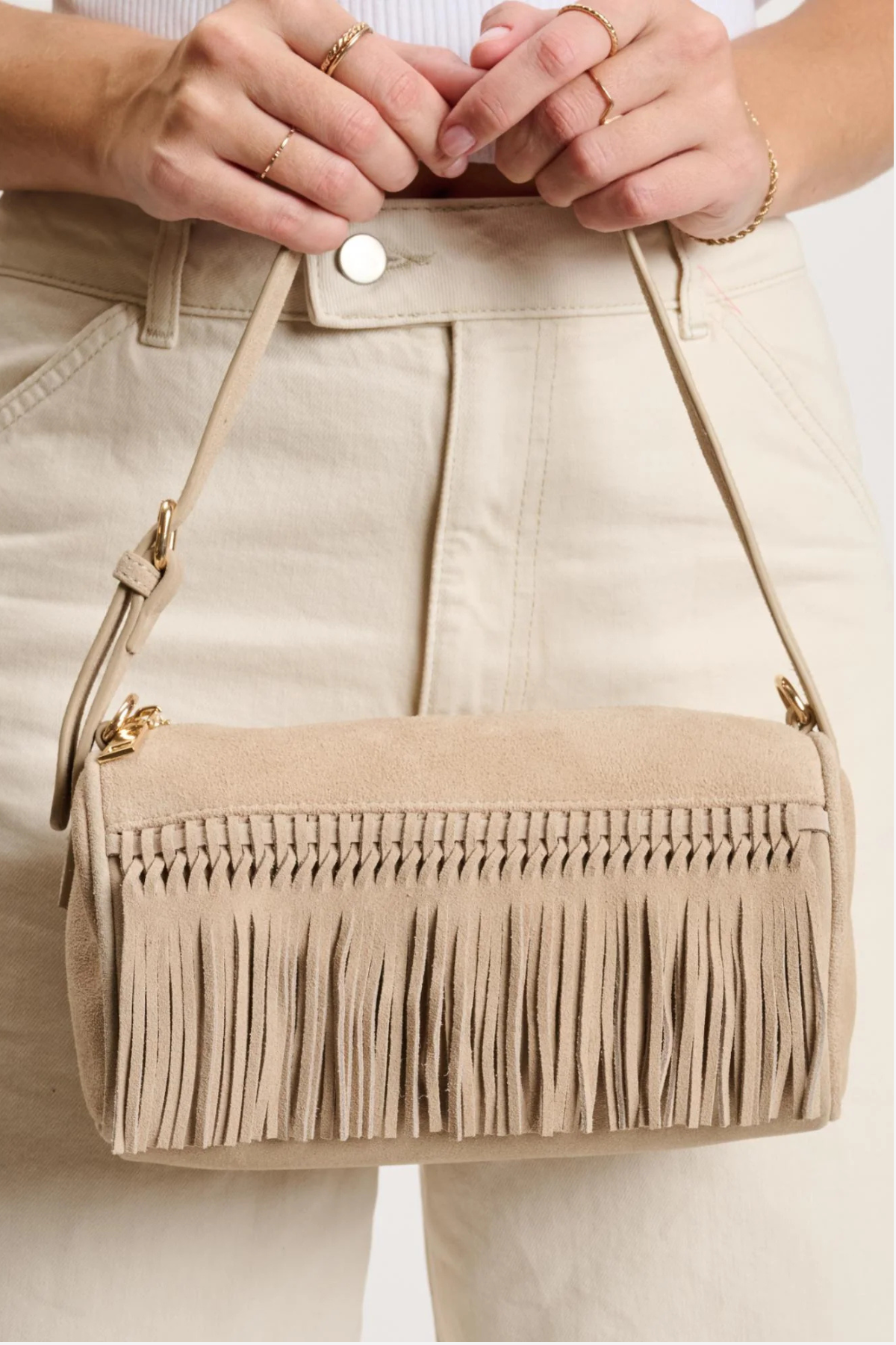 Women's natural shoulder bag featuring a structured silhouette, top handle, and neutral finish.