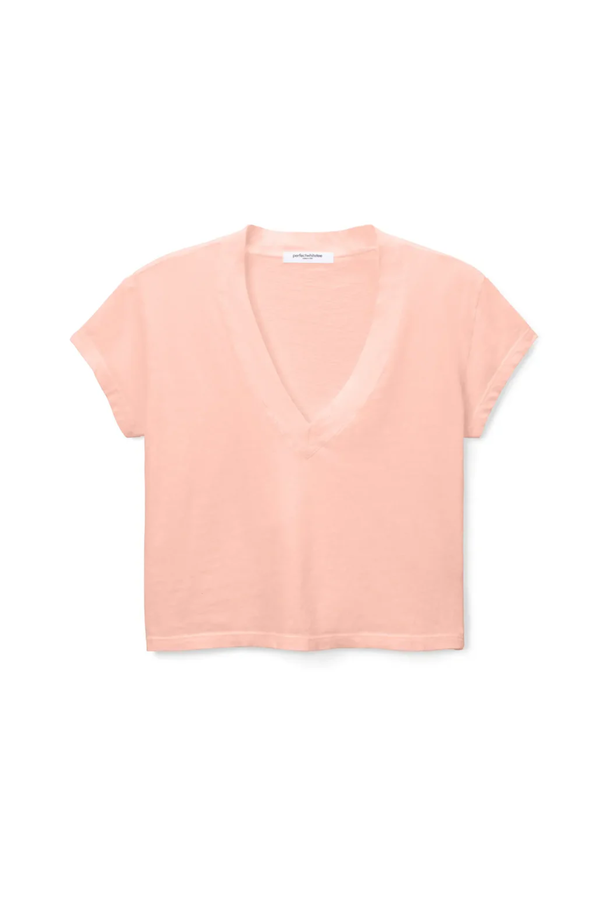 peach short-sleeve top on a white background