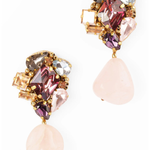 A pair of gold-tone drop earrings featuring a cluster of faceted crystals in pink, purple, peach, and smoky gray, with a large light pink teardrop stone hanging below each earring, set against a plain white background.