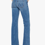 Blue jeans worn by a person on a white background