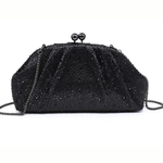 A black beaded evening clutch bag with a chain strap and a kiss-lock clasp adorned with two black beads, shown against a plain white background.