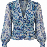 A long-sleeve blouse with a blue and white abstract floral pattern, featuring a gathered ruched waist and a deep V-neckline, shown against a plain white background.