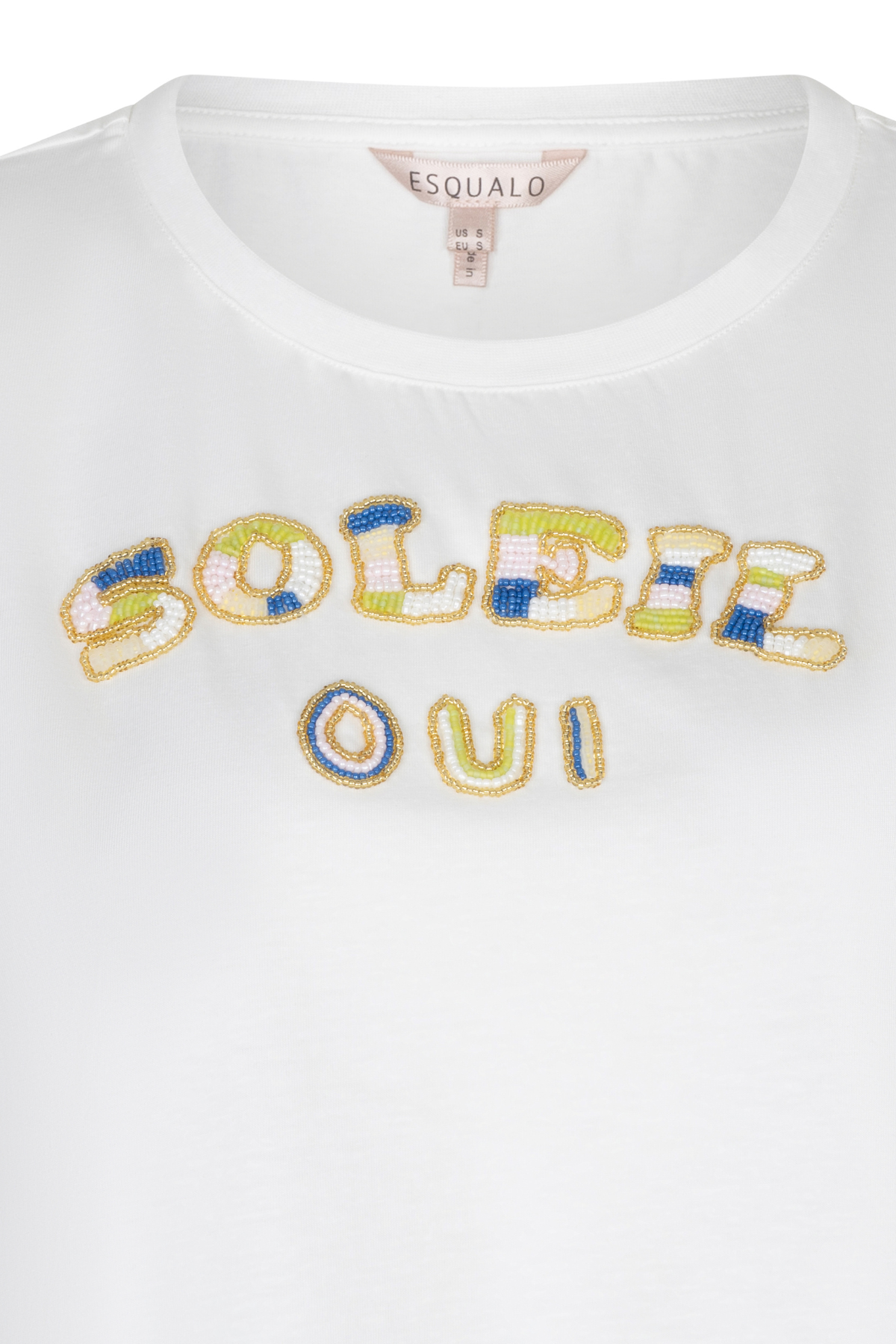 close up of beaded t-shirt on white background 
