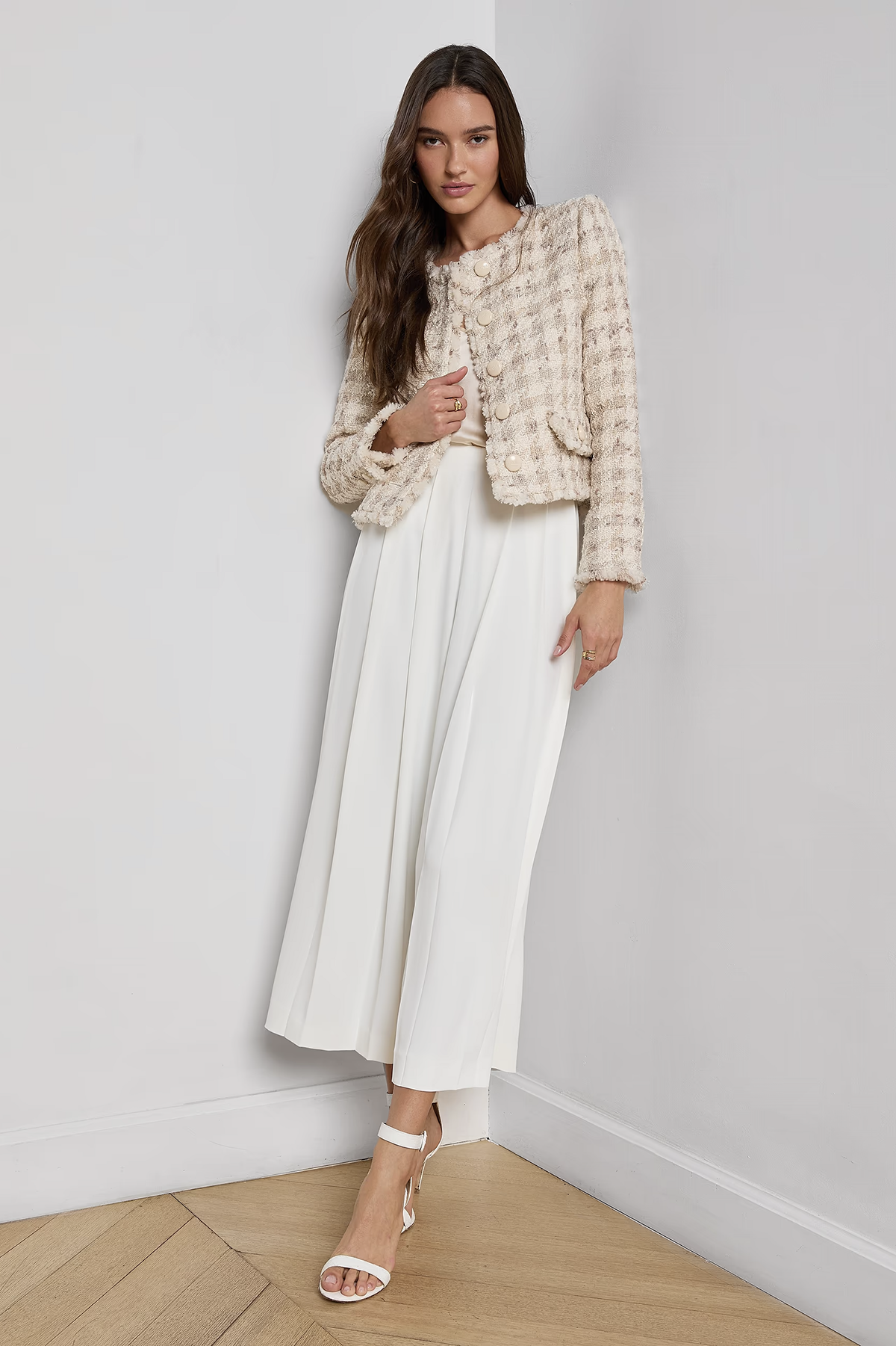 Collarless tailored jacket in a neutral tone, styled over a lightweight top