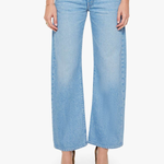 Light blue jeans worn by a person on a white background