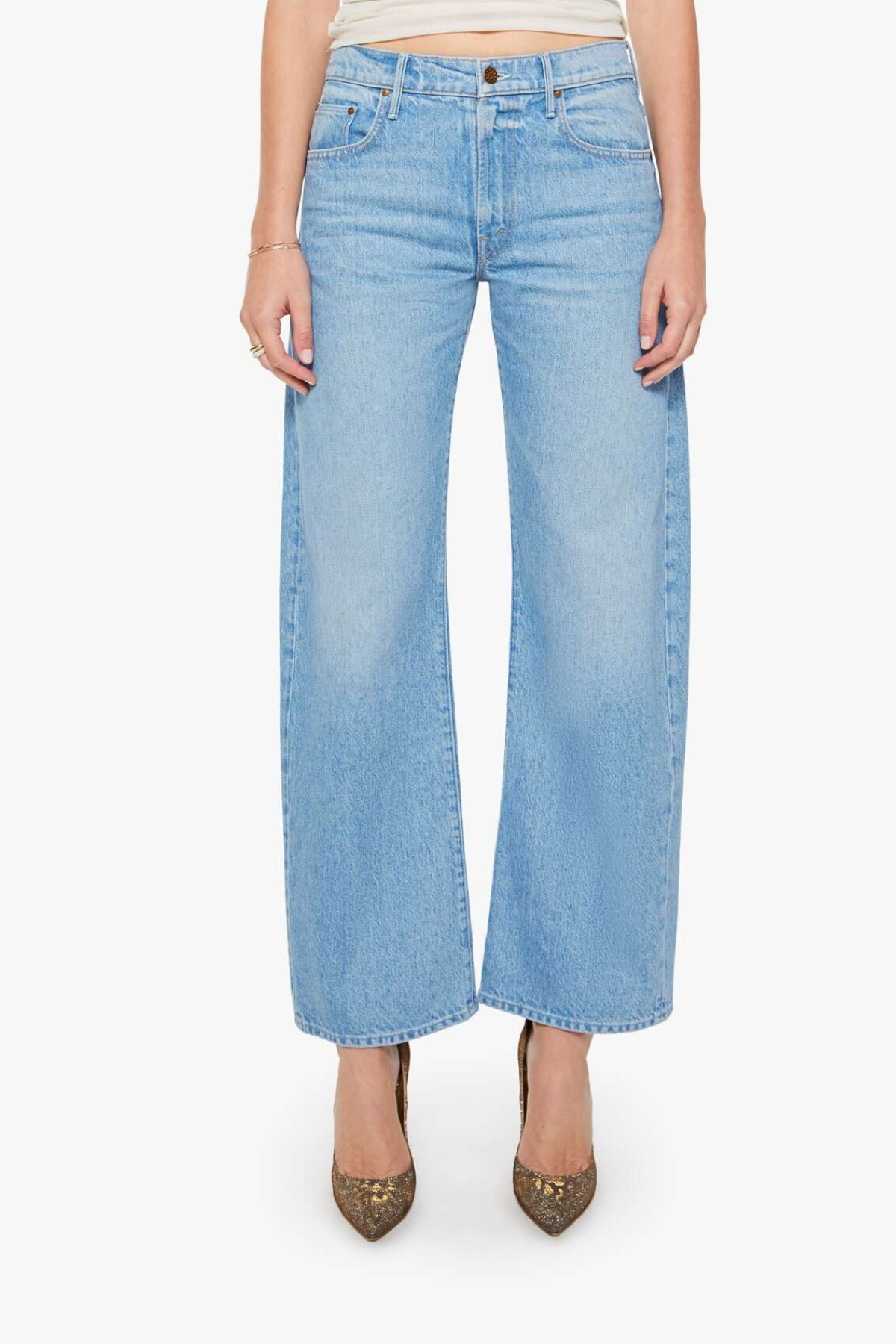 Light blue jeans worn by a person on a white background