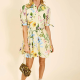 Woman wearing a floral dress with a beige background