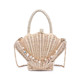 Woven handbag shaped like a shell with a chain strap on a white background