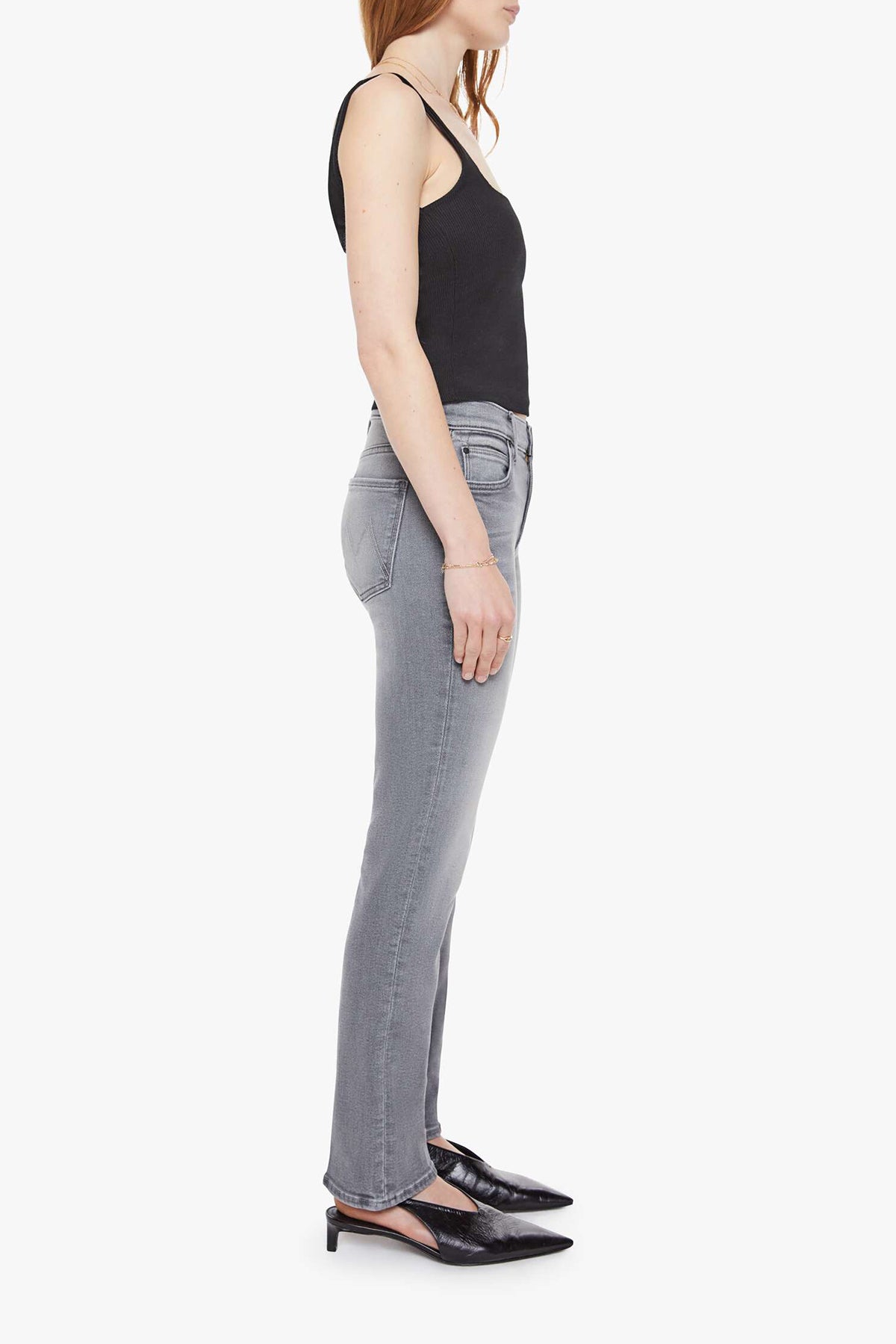 Woman wearing grey straight-leg jeans with a soft, structured fit and clean lines