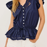 Navy blue top with ruffled sleeves and hem on a white background