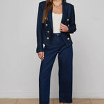 Navy structured blazer styled over a simple top.