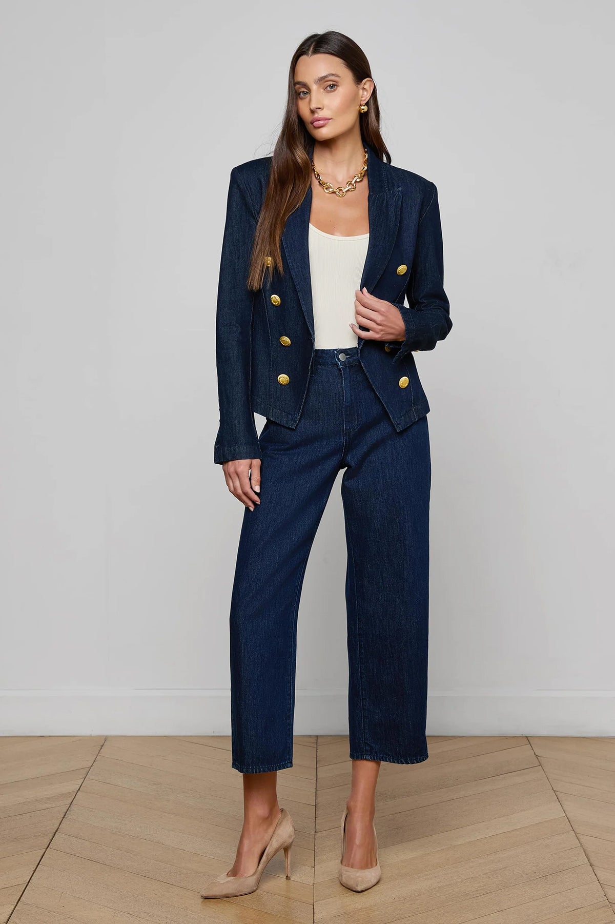 Navy structured blazer styled over a simple top.
