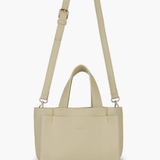 Beige handbag with a strap on a white background