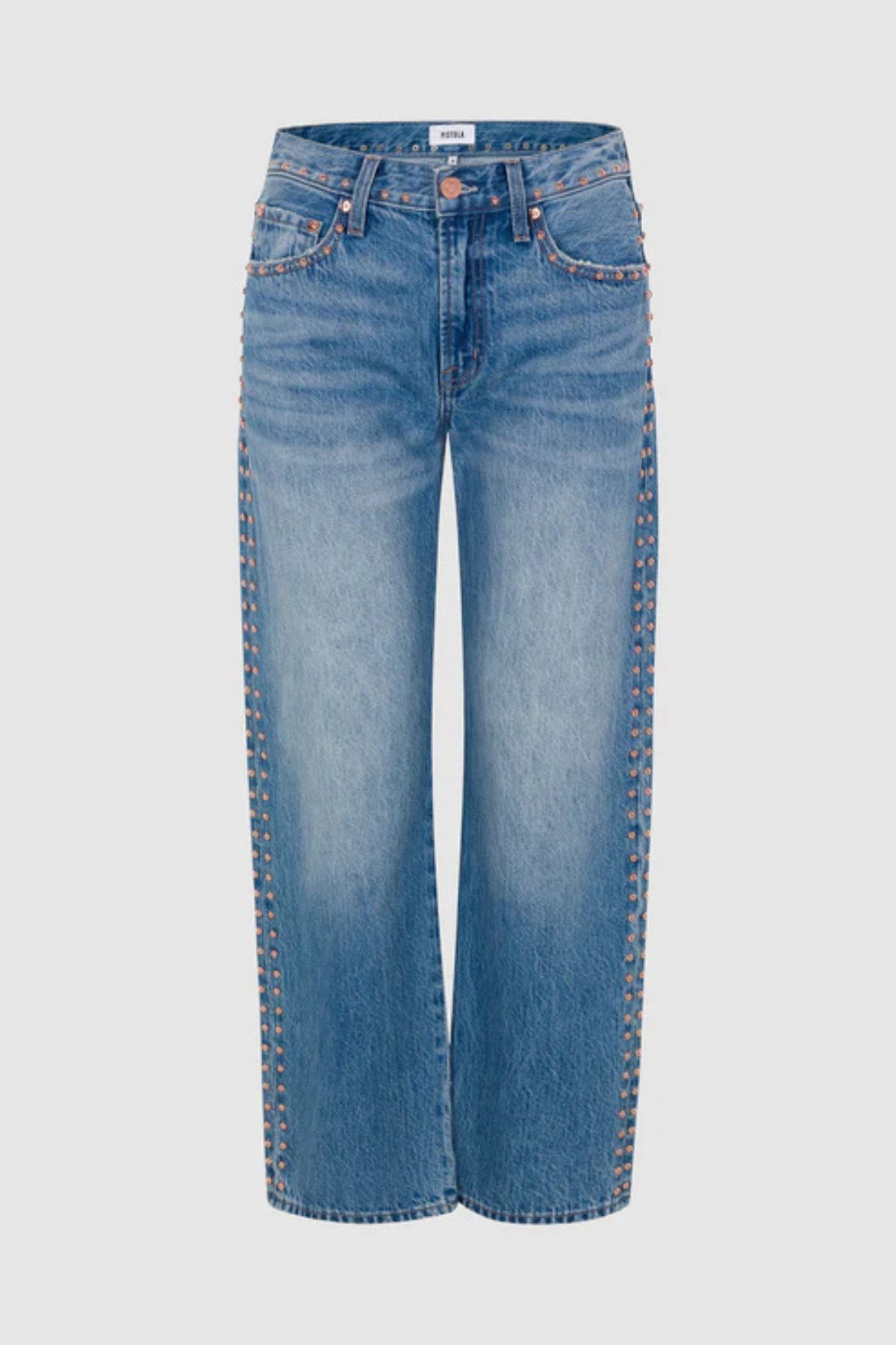 Light blue denim jeans with decorative gold-tone rivet detailing running down the outer seams, shown against a light gray background.