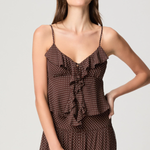 Model wearing a mahogany and ecru color-block camisole with adjustable straps.