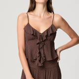 Model wearing a mahogany and ecru color-block camisole with adjustable straps.