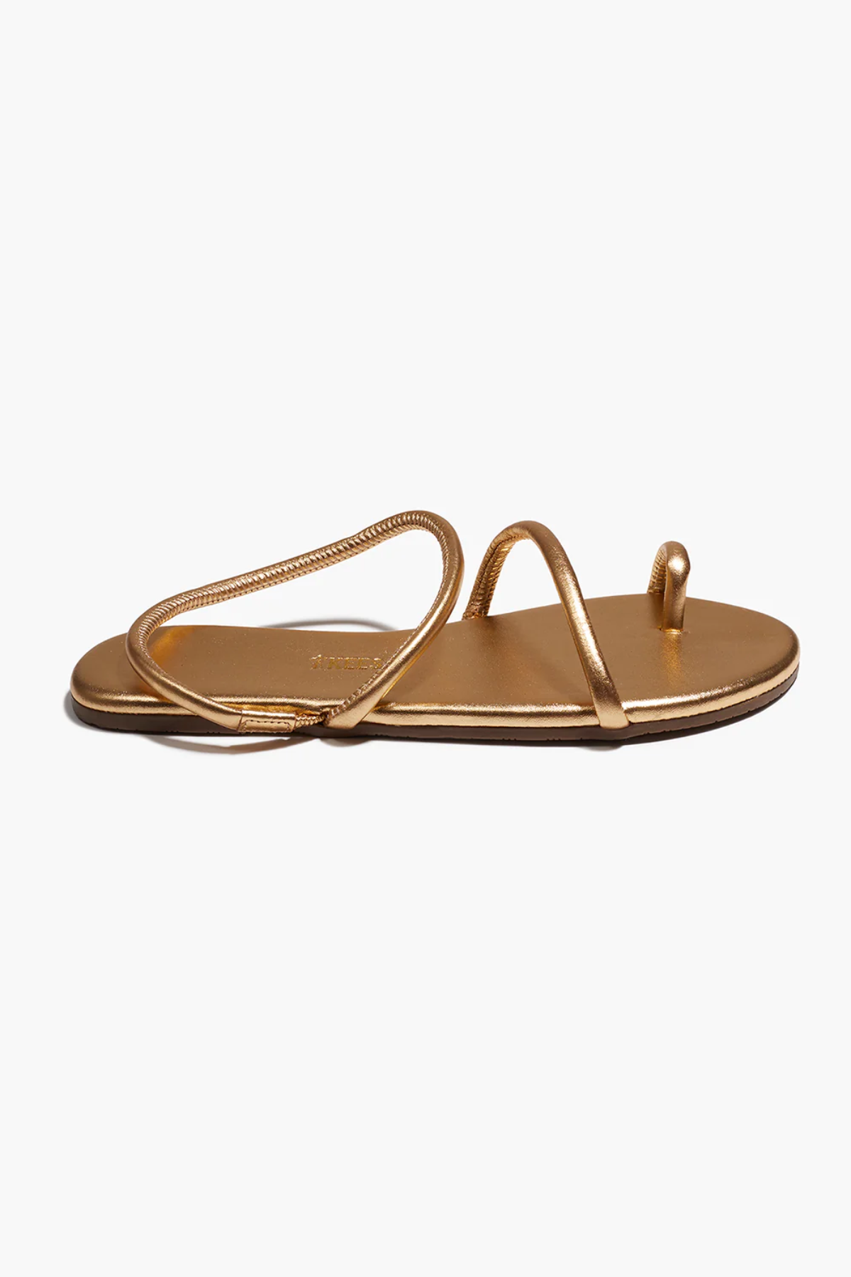Gold sandal on a white background