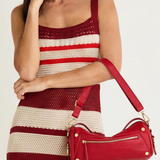 Medium-sized structured leather handbag in a rich red hue featuring a top handle and detachable shoulder strap.