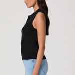 side view of person in black top and denim on white background 