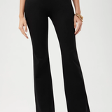 Person wearing black wide-leg pants on a white background