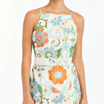 Woman wearing a floral dress with a white background