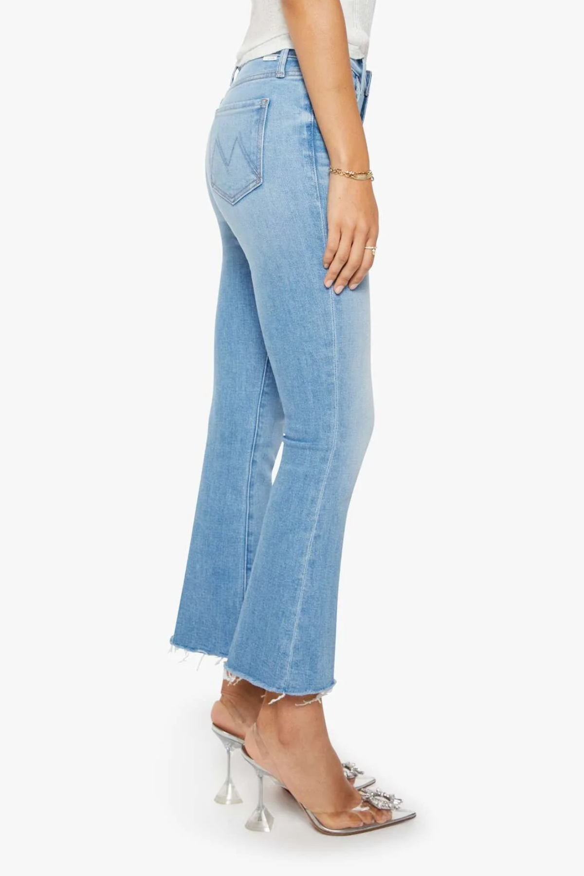 Light blue jeans worn by a person on a white background