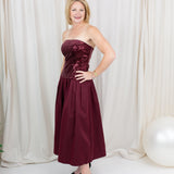 Burgundy sequin dress for evening wear paired with heels