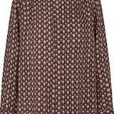A long-sleeve button-up shirt with a high mock neck, featuring an all-over repeating pattern of small beige and light brown skulls on a dark brown background.