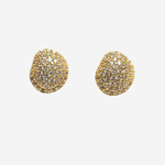 Gold earrings with blue gemstones on a white background