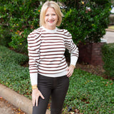 Striped knit sweater top styled for everyday wear.