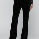 Black trousers on a gry background.
