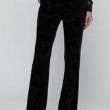 Black trousers on a gry background.