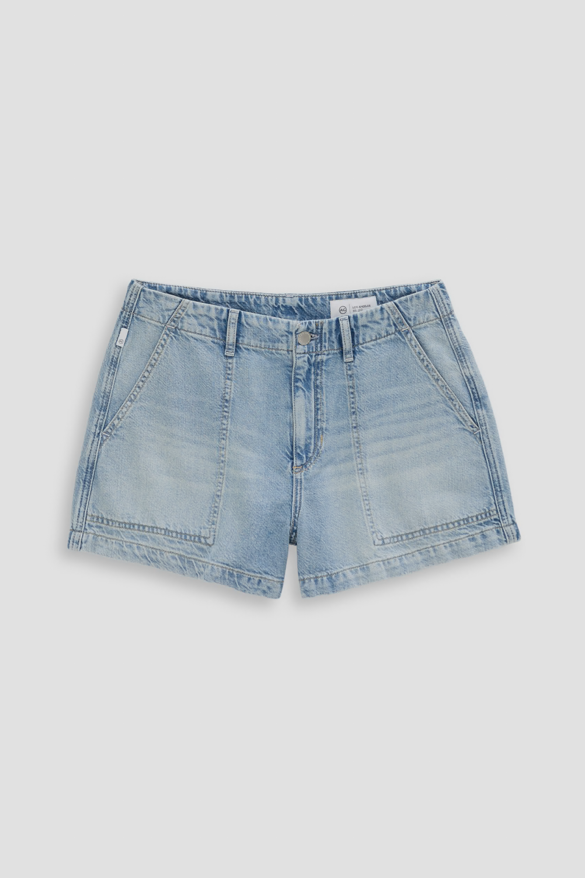 Blue denim shorts on a light gray background