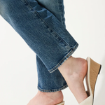 woman in white wedges on white background 