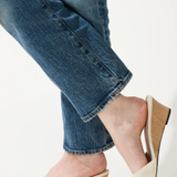 woman in white wedges on white background 