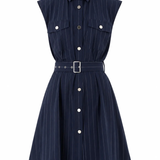 A sleeveless navy blue pinstriped shirt dress with a pointed collar, button-down front, two chest flap pockets, and a matching fabric belt with a silver buckle, shown on a plain white background.