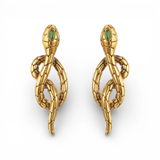 Gold snake-shaped earrings with green gemstones on a white background