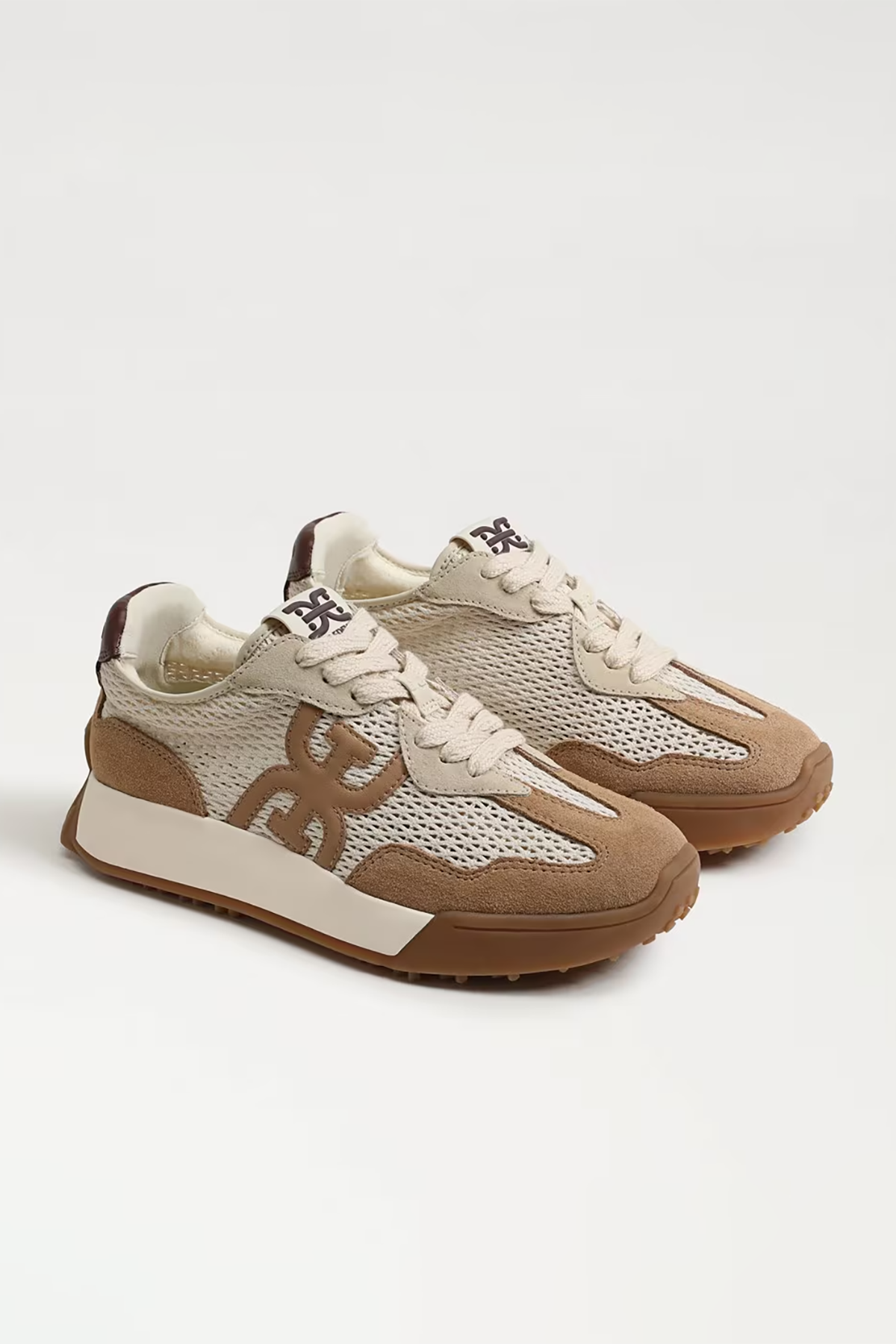 Pair of brown and beige sneakers on a white background
