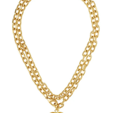 A double-layered gold chain necklace with a polished gold heart pendant, displayed on a clean white background.