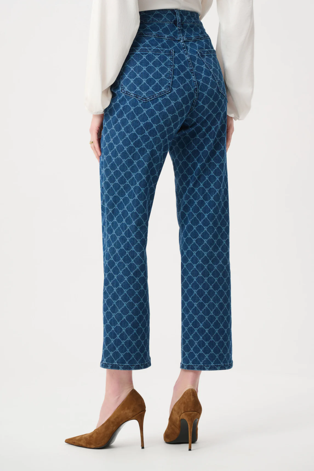 Person wearing blue patterned pants on a white background