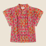 floral blouse on tan background 