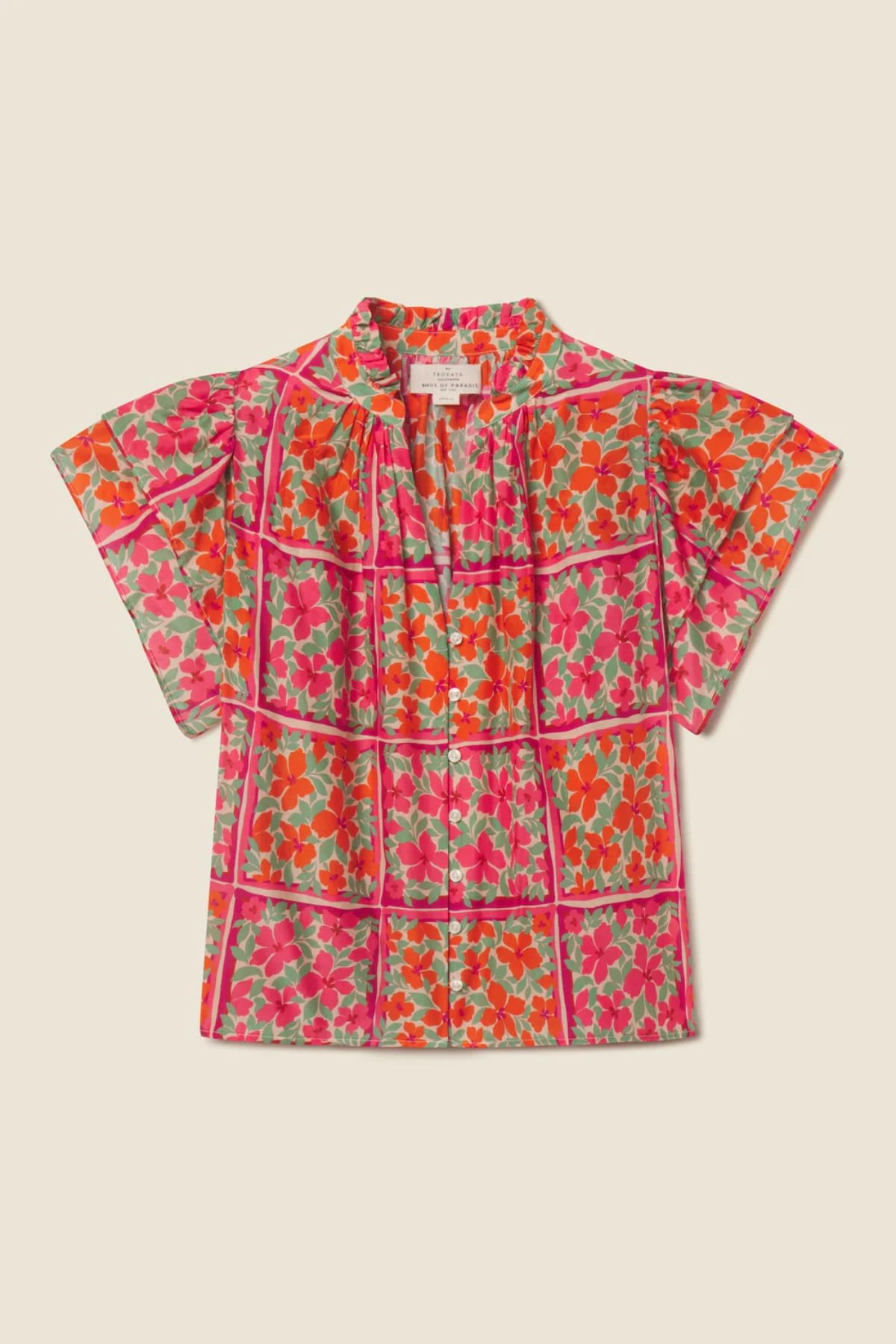 floral blouse on tan background 