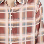 Plaid shirt with a pattern of red, beige, and blue on a plain background