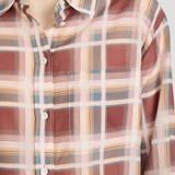 Plaid shirt with a pattern of red, beige, and blue on a plain background